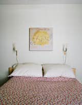 The master bedroom. The coverlet is from Urban Outfitters. The painting is by Helen Rice.