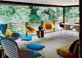 A screened-in porch overlooks the pond and sports furniture by both Harry Bertoia and Dow himself.

Photo by: Balthazar Korab  Photo 4 of 28 in Hometown Hero