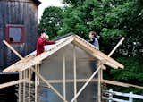 Pictured here are two of the students at work on the Chicken Chapel. "They were great," Moskow says. "It'd be sunny in the morning then there'd be a rainstorm in the afternoon, but no one complained. It took really, really long days to finish it but they were gung-ho to get it done and were very proud of it at the end."  Photo 5 of 10 in Chicken Chapel by Miyoko Ohtake