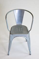 I am particularly fond of this experiment—an addition to the iconic galvanized Tolix A56 chair, designed by Xavier Pauchard for Tolix. "The 'A’ chair was born out of an understanding of material and is a great example of technique and industrial knowledge informing the aesthetic of the design," says Wilson. Here it is unadorned.