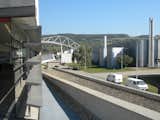 From the rooftop deck of the Fire Station, the view looks back over the campus and toward the rolling hills across the road. To the right is one of Grimshaw's factories. It was built in a rush after the 1980s fires and because many of the parts were prefabricated, it was completed in just four short months.