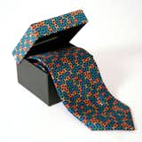 The Pinwheel pattern reappears in a different form on this graphic silk tie.