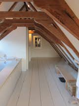 A very steep and narrow flight of stairs led to my favorite part of the room: a big bathroom tucked into the attic, with original wooden beams arching overhead.