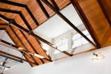 The original rafters in the kitchen are exposed and topped with salvaged fir bleacher seating. The high ceilings allow the warmer air to stratify near the ceiling. A south-facing clerestory brings light deep into the space.