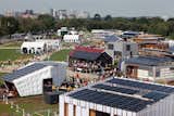 Visitor tour the U.S. Department of Energy Solar Decathlon 2011 in Washington, D.C., Friday, Sept. 30, 2011, with Arlington, VA, left, and the Lincoln Memorial, right, in the background. (Credit: Stefano Paltera/U.S. Department of Energy Solar Decathlon)