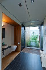 Here's the bathroom. Water flows through the floor into a series of constructed wetlands that filer the water for future non-potable uses. The ceramic tile is by Emil America.  Photo 9 of 26 in Solar Decathlon Highlights by Diana Budds
