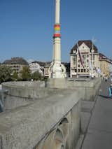 I'd seen images of urban knitting and knit graffiti all over the web but had never seen it in person before I visited Basel. Each light post along the Mittlere Brücke was decorated with its own knitted sleeve like the one in this image.