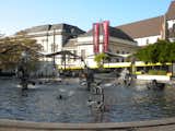 The most famous fountain in Basel is the Tinguely Fountain next to the Basel Theater. This funny fountain features a large, shallow pool with moving sculptures by Swiss artist Jean Tinguely that spit water in all directions and make sounds as the metal parts clap the water.