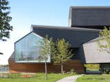 The most recent structure at the Vitra campus is Basel-based firm Herzog & de Meuron's VitraHaus. The building, which has the appearance of seven log houses stacked one on top of another, holds the entire Vitra furniture collection. Visitors are encouraged to interact with the pieces, and sales associates who work on the floors are happy to help sell you anything you see.