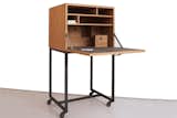 The business end of things is this fold-down desk, ideal for a laptop and better still for saving the space a bulky desk might take up. Best of all, you can wheel the thing away when you're through with it.  Search “10 space saving desk designs” from Bar, Desk, NewYorker