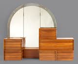 A gunwood dresser with a mirror by R.M. Schindler, made for the Ruth Shep house in Silver Lake, circa 1934–38. Schindler created several house designs for Shep before settling on the later design, for which he also designed furnishings.  Photo 8 of 11 in "Living in a Modern Way" at LACMA by Erika Heet