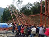 Villagers raise one of the structures Hseih Ying-Chun designed.  Photo 1 of 3 in Curry Stone Prize Winner Announced