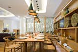 The communal table trend is still surging, and here is Poncelet's entry. I'm all for chatting up my neighbor, and better yet when it's done from a Wishbone chair by Hans Wegner.