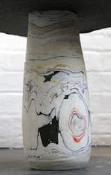 Wustenberg also crafts other shapes and objects, like this chubby table leg. The layers of revealed color resemble geologic forms.  Photo 3 of 3 in Recycled Paper Lights