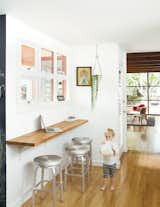 A wall-mounted oak bar is where Siminovich and Kerner drop their keys, pound away on their laptops, and occasionally eat a quick meal with Matilda, their two-year-old daughter.