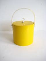 Among the many design finds at Back Garage, an online retailer of vintage pieces, is this yellow Georges Briard ice bucket.