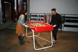 Guests at the event face off on one of RS Barcelona's new foosball tables.