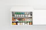 Hide Your Food Away

The aesthetic throughout the house is supremely uncluttered, and that goes double for the kitchen, which dominates the central public space. “My wife is the master organizer,” says Paul. “In Japan space is so tight, I think it is in their DNA.” The kitchen and 

wall-storage system by the German company Leicht continues the muted design palette and conceals it all from the microwave to the dishes. 

leicht.de