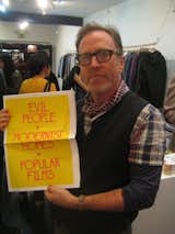 Larry Schaffer is holding up a great tabloid from the pop-up shop. He called the selection of goods a "tight, holiday edit of what is our best, simple, understated gift items."