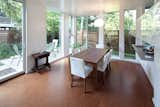 The dining room, just off the kitchen, is actually down a half level from the living room and entry. You can see the other outdoor room outside the sliding glass door.  Photo 9 of 9 in Braver’s New World