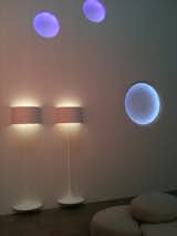 Two of Sebastian Wrong's Spun Lights hover over the floor, beneath three glowing Circle Lights.