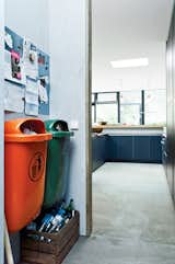 Bring In the Trash

With an eye for the industrial, Winterhalder built the garbage area in the kitchen around two standard-issue plastic trash cans common in German cities. One is orange; the other, green. These in turn inspired her to start adding color accents around the house.