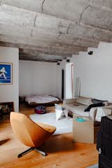 The rest of Kordík's small apartment is given over to an open-plan living and bedroom. The waves of the concrete ceiling offer a bit of overhead character while lounging on the couch or in bed.
