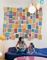 Cleménce and daughter Clara hang out on a Pierre Paulin sofa, under an installation by artist Alan McCollum.  Photo 12 of 22 in Coolest Homes for Artists & Art Collectors June 12, 2012 by Jaime Gillin from Coolest Homes for Artists & Art Collectors