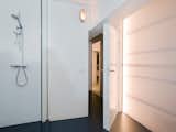 The bathroom is tucked inside the lightbox on the second level.  Photo 7 of 9 in Parksite Residence, Rotterdam by Jane Szita