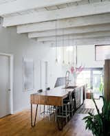 Nicolas Gervais designed the pendant lights above the kitchen island, which was designed by Plasse and built by woodworker Stéphane Bilodeau.