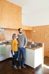 Kitchen, White Cabinet, and Wood Counter Their tenants include veterinary student Leslie Carter and intern architect Brad Raines.  Photos from Spirit of the South
