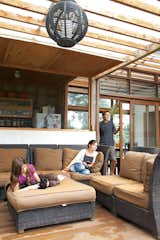 Just off the kitchen is the lanai, which serves as the family’s main gathering spot. The polycarbonate roof lets light through but keeps the rain at bay.