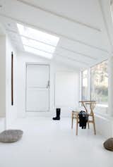 The skylight over the home’s entrance “helps simulate a feeling of grandeur and creates an airy and welcoming atmosphere,” says Bjerre-Poulsen.