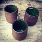 Here's a trio of the Bamboo series planters. The rough brown exterior is contrasted nicely with a smooth green glaze inside.