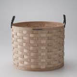 A woven Appalachian white ash basket is the ideal catchall for magazines, throw blankets, toys, and fire logs.  Photo 8 of 10 in Accessories from Schoolhouse Electric by Jaime Gillin