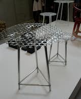 Nendo has several shows at satellite events and the fairgrounds, but these tables, which look like metal pieces for outdoor use are actually made from bamboo.