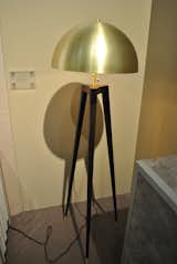 Fire Tripod lamp, with a spun-brass shade, lathe-turned legs and brass feet, by Matthew Fairbank Design.