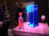 Yves Behar demonstrated his new SodaStream design at a dinner in the Meatpacking District on Sunday evening. There are three bubble-strength settings (three carbon droplets for me, thanks) and you attach the reusable bottle to the nozzle then push down the entire rectangular attachment at top to dispense the bubbles.