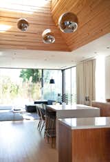 Dining Room and Chair The Globo di Luce pendants in the kitchen are by Roberto Menghi for Fontana Arte.  Photo 8 of 20 in Dream Homes In and Around Los Angeles by Diana Budds from You Won't Be Calling This House a "Man Cave"