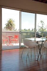 Her Lasalle patio set is from Target and her Engineer dining table and Orbit armchairs are from CB2.  Photo 5 of 13 in 131-Day House