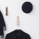 With its Stropp Coat Hook, by Lassen completely redefines traditional hanging pegs and hooks. Each Stopp is comprised of a luxurious leather loop and metallic peg. Items can be hung through the loop or over the peg. Coats and other clothing can be placed on a hanger and hung from the loop as well.