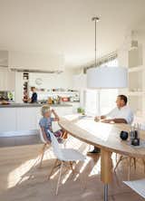 The kitchen of a home on an Amsterdam canal “is where it all happens,” says Van Zeijl. As the hub of the home, the room is situated at the front of the house and features a minimal palette and Belgian granite countertops. The table is by Pilat & Pilat and the pendants are from It’s About Romi.
