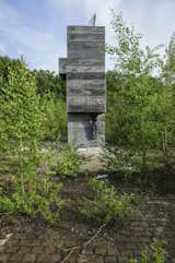 Visitors are meant to progress from level to level at their leisure. “The ritual of the sauna is going into the sauna box, jumping into the cold water, and then relaxing,” says Kampshoff. “All concrete elements are simply stacked on another and there is a gap of light between each one, offering breathing space.”  Photo 3 of 8 in Inside This Modern Tower Is an Idyllic One-Man Sauna by Nadja Sayej