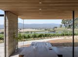 "The altitude at which the pavilions are positioned presents a serene setting where one can only hear the wind in the trees and experience the vista of the vineyard and lake below," Warner and McCabe comment. Maca Huneeus of Maca Huneeus Design seved as the interior designer on the project and custom-made the table and bench using FSC-certified Afromosia wood.