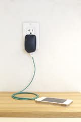The charger is about 3 inches tall, 2 inches wide, and an inch thick, which makes it larger than almost any wall outlet-to-USB plug you'll see, but the design is meant to distinguish it from other wall chargers.The triangle pattern on the device has an outstanding single LED that is orange while charging, green when the device is charged, and off when it's drawing no power.