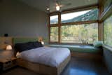 Lastly, a master bedroom opens up to the landscape around it and can sleep an extra two guests on day beds.