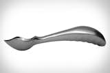 The first ice cream scoop, or “mold and disher,” dates back to 1897. The design has remained largely unchanged for over a century. One modification was the Belle-V, which used aluminum’s thermal conductivity to transmit the warmth of a hand to the ice cream. Unlike the Midnight Scoop, the Belle-V is not symmetrical and must be ordered as a right- or left-hand version.  Photo 4 of 6 in The World's First Ergonomic Ice Cream Scoop? by Alexander George