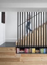 The caged staircase was designed by architect Patrick Ousey, with whom Flournoy collaborated in the home’s design. Although initially unconvinced by the staircase detail, “it is a great example of how collaboration brings in different perspectives,” says Flournoy.