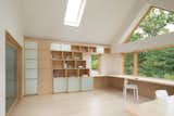 The pixelated shelving system, made of birch and acid-etched mirrored glass, as well as the cantilevered desk, were customized for the Woolford’s space. A large glass sliding door framed in white oak separates the addition from the rest of the home. The chairs are from Ikea.  Emily Shapiro’s Saves from A Bright Office Addition in Cape Cod