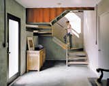 shipping container home living area with staircase